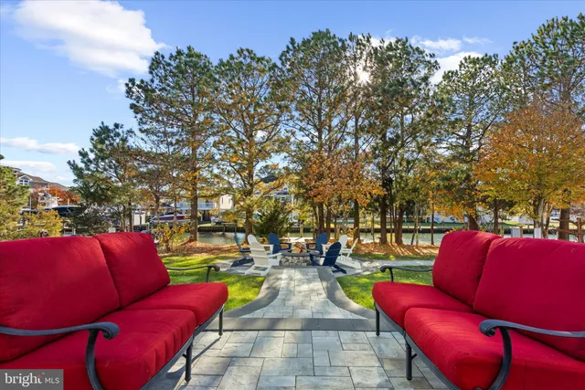a view of a house with a swimming pool yard and outdoor seating