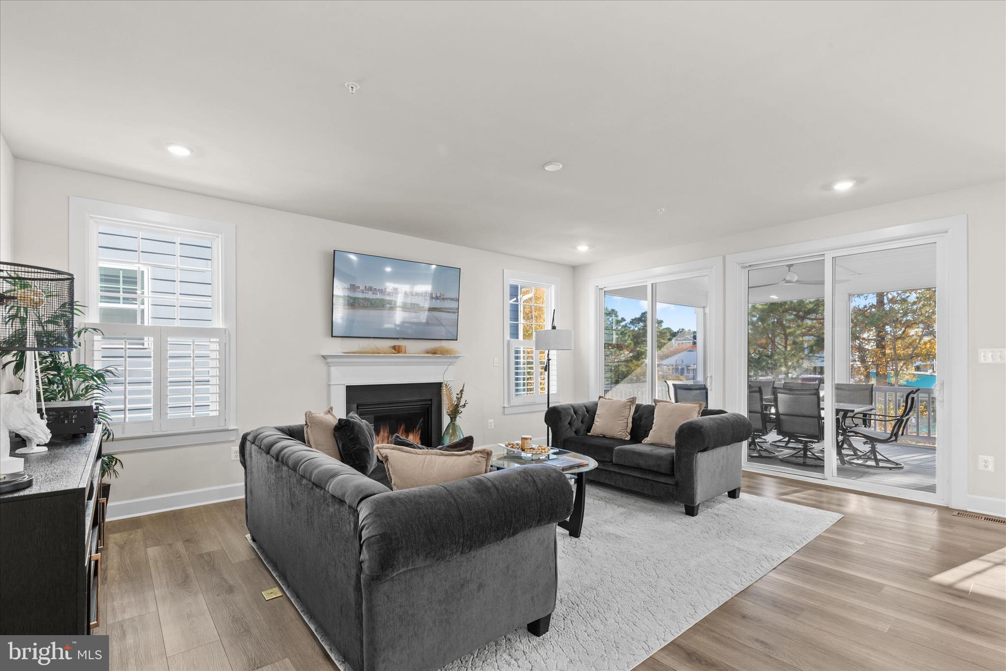 12377 Hidden Bay Drive Berlin, MD 21811 - Photo 8 of 71 a living room with furniture large window and wooden floor