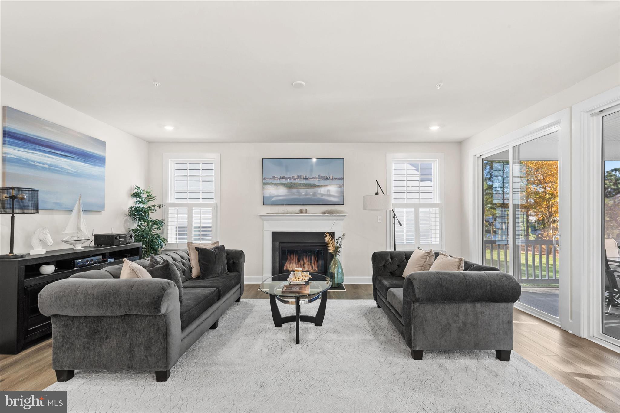 12377 Hidden Bay Drive Berlin, MD 21811 - Photo 9 of 71 a living room with furniture and a fireplace