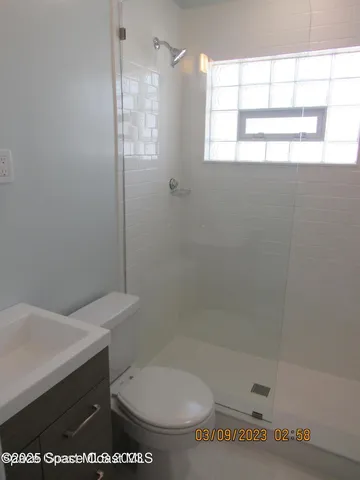 a view of a room that has a window in it