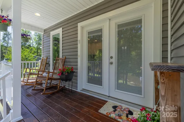 a living room filled with furniture and a potted plant