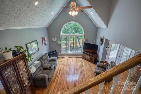 a living room with furniture fireplace and flat screen tv