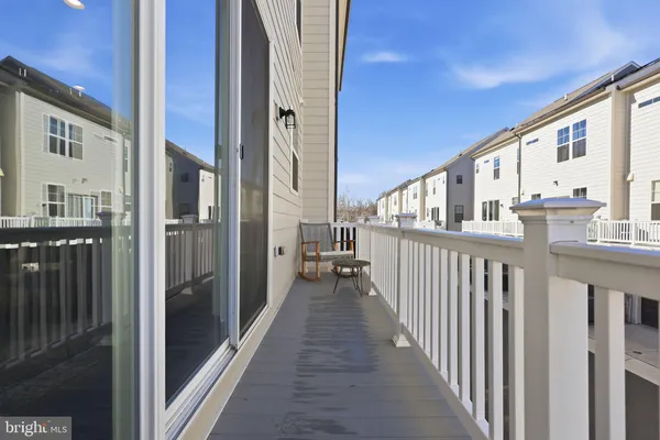 a view of a balcony with wooden floor