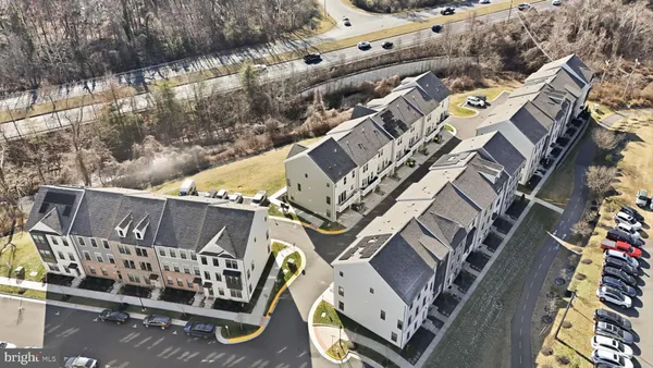 an aerial view of residential building with yard