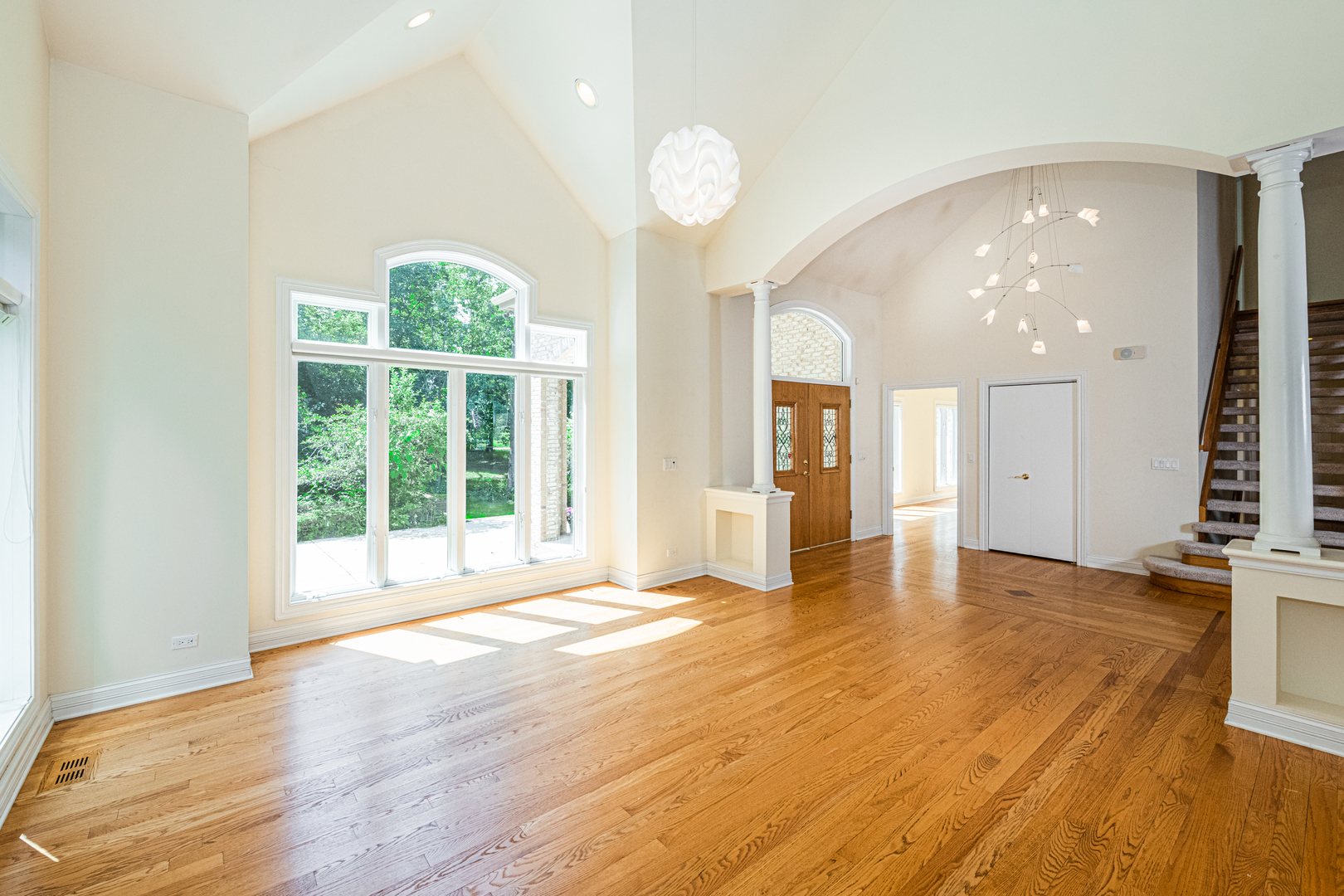 1071 Bonner Road Wauconda, IL 60084 - Photo 14 of 61 a view of an empty room with wooden floor and a window