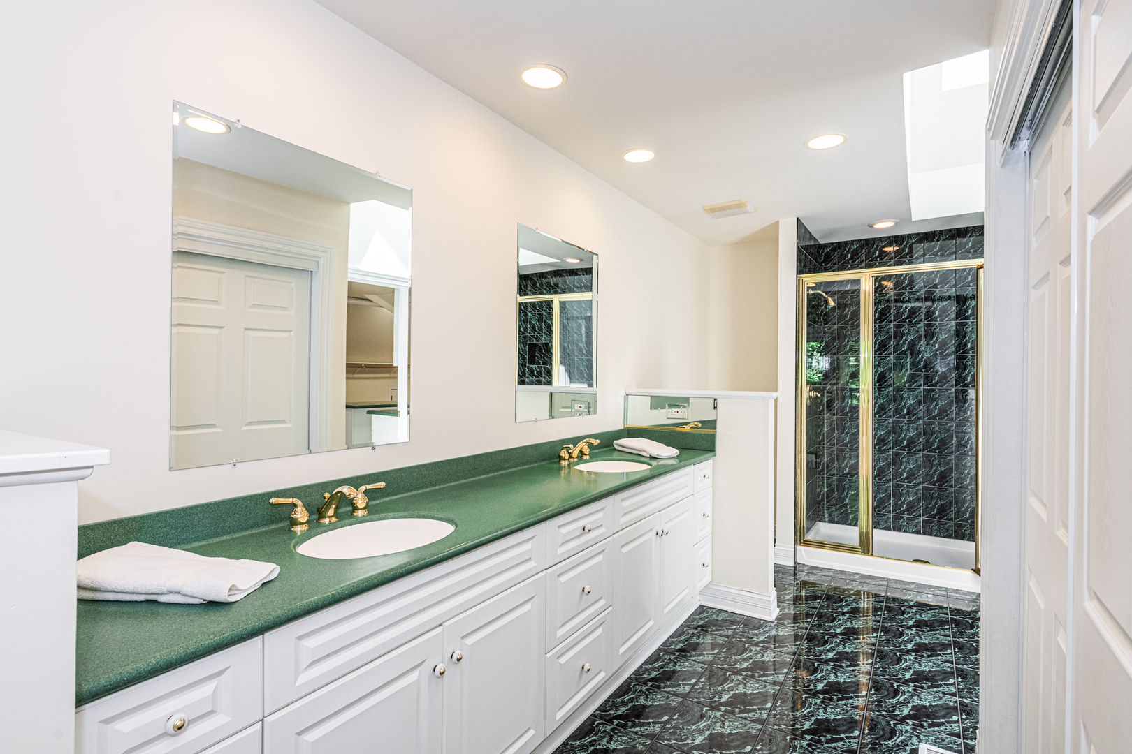 1071 Bonner Road Wauconda, IL 60084 - Photo 31 of 61 a bathroom with a granite countertop sink and a large mirror