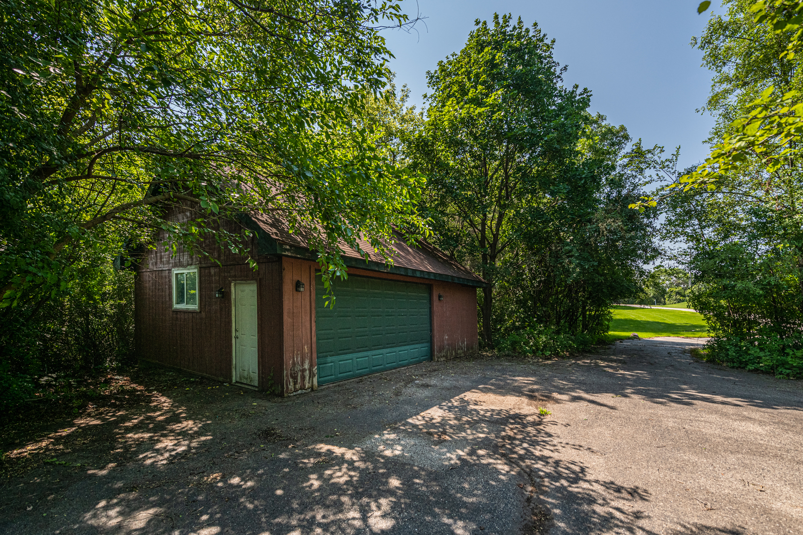 1071 Bonner Road Wauconda, IL 60084 - Photo 54 of 61 a view of a house with a yard and large tree