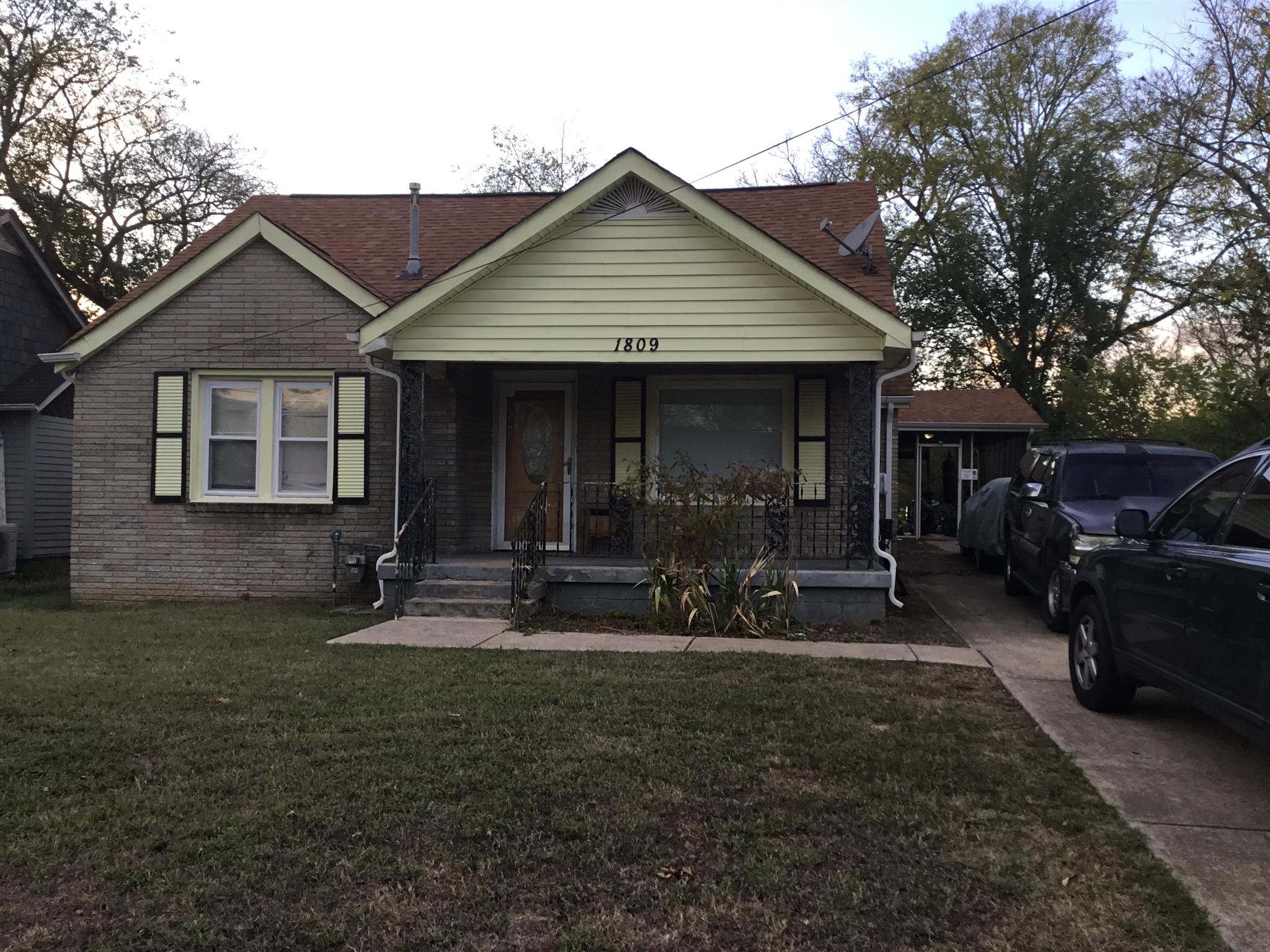 a front view of house with yard and seating space