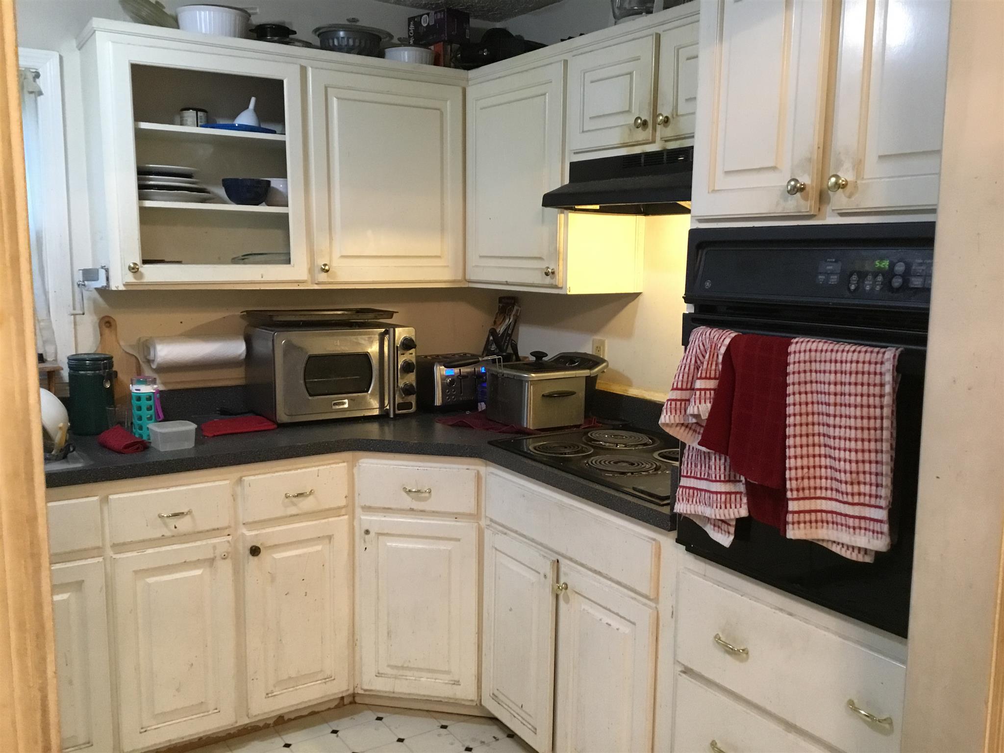 1809 South Hamilton Road Nashville, TN 37218 - Photo 6 of 15 a kitchen with stainless steel appliances granite countertop white cabinets and a microwave oven