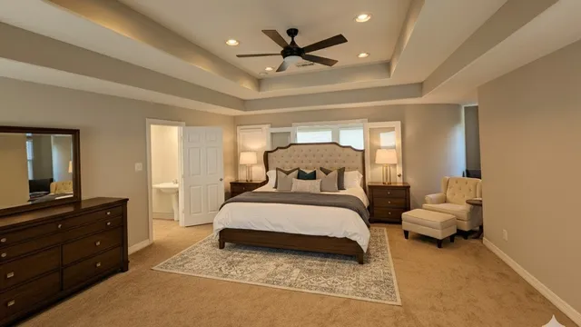 a bedroom with a bed and a dresser