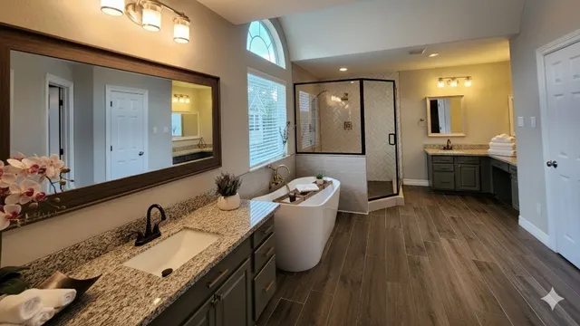 a bathroom with a granite countertop sink a mirror and a bathtub