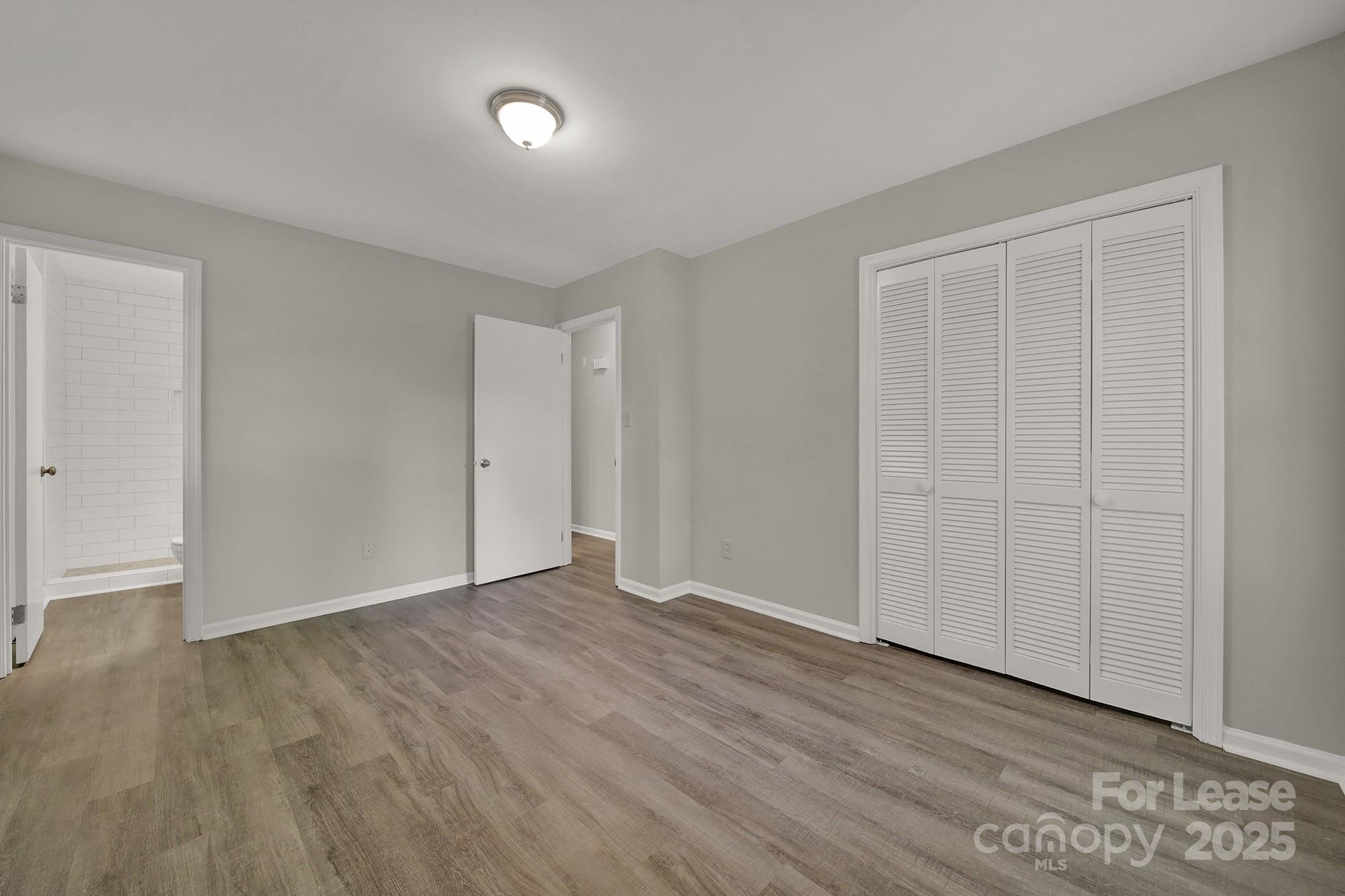 515 Wilcrest Drive Matthews, NC 28105 - Photo 13 of 19 a view of an empty room with wooden floor