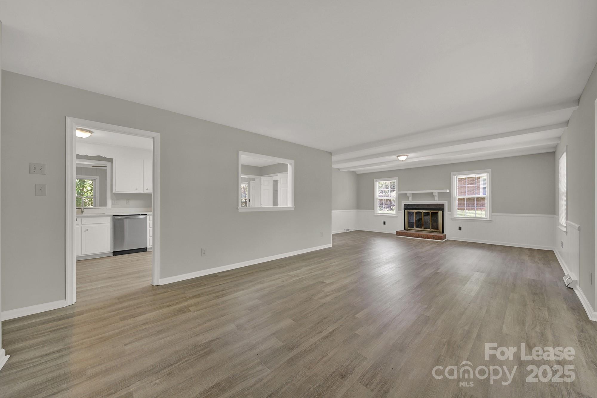 515 Wilcrest Drive Matthews, NC 28105 - Photo 2 of 19 a view of empty room with a fireplace and wooden floor