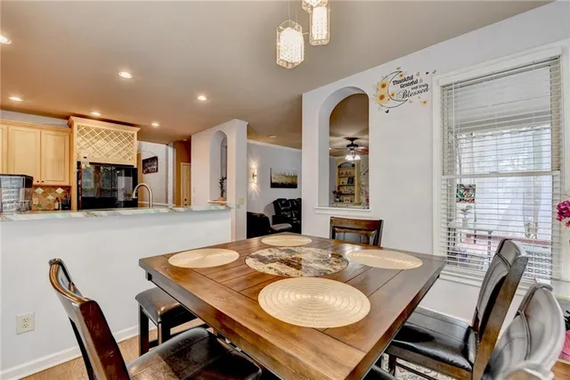 a bathroom with a sink toilet and mirror