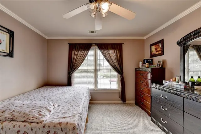a bathroom with a double vanity sink mirror and toilet