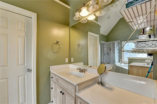 a view of a backyard with a wooden fence