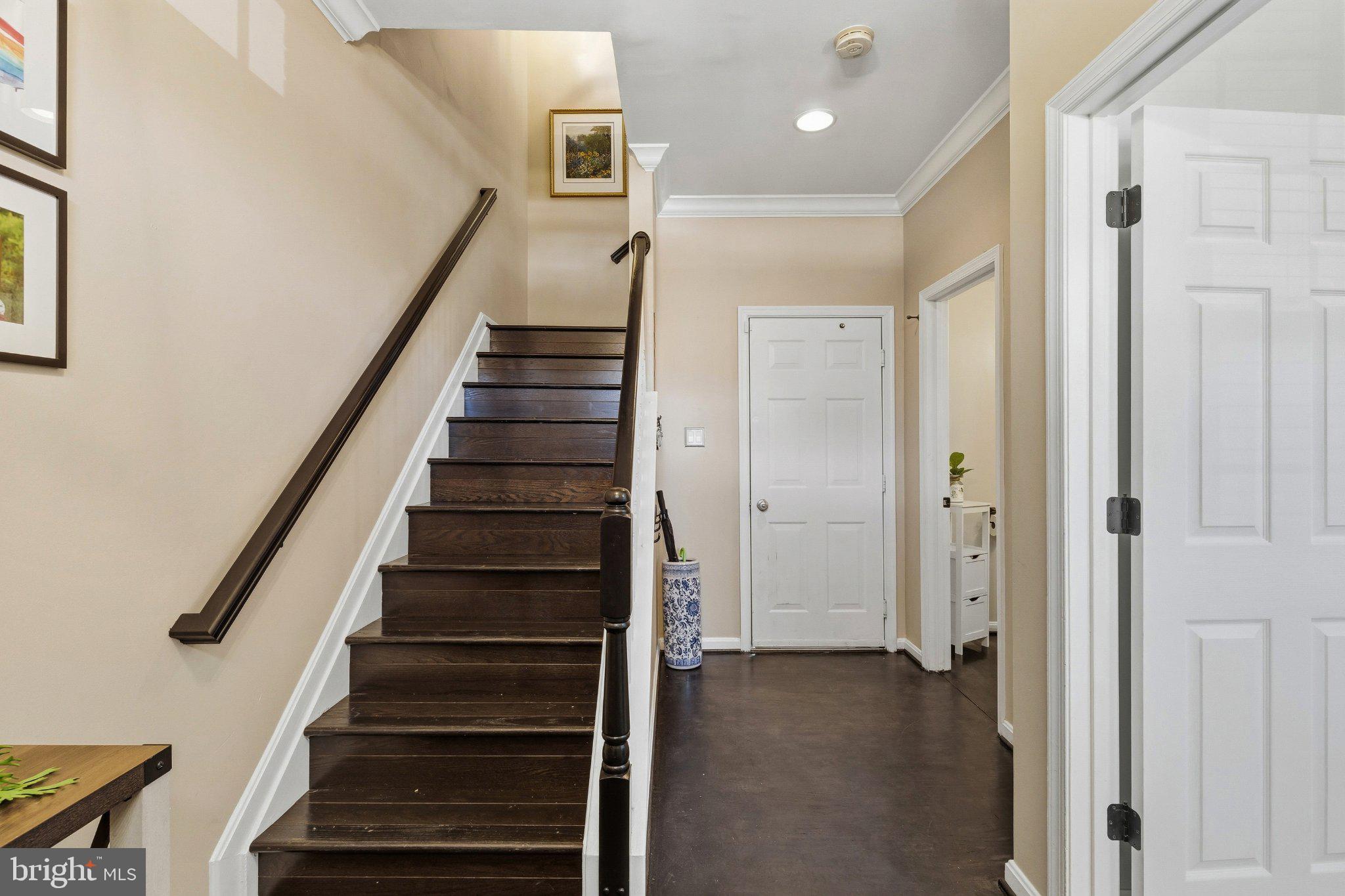 2668 Merlin Court Odenton, MD 21113 - Photo 26 of 42 a view of entryway with wooden floor and stairs