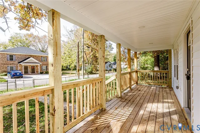 a view of balcony with wooden floor