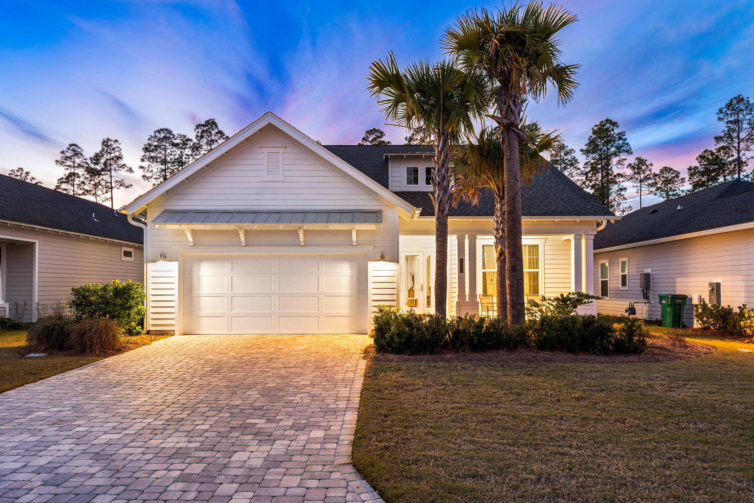 69 River Rise Way Watersound, FL 32461 - Photo 1 of 46 a front view of a house with garden