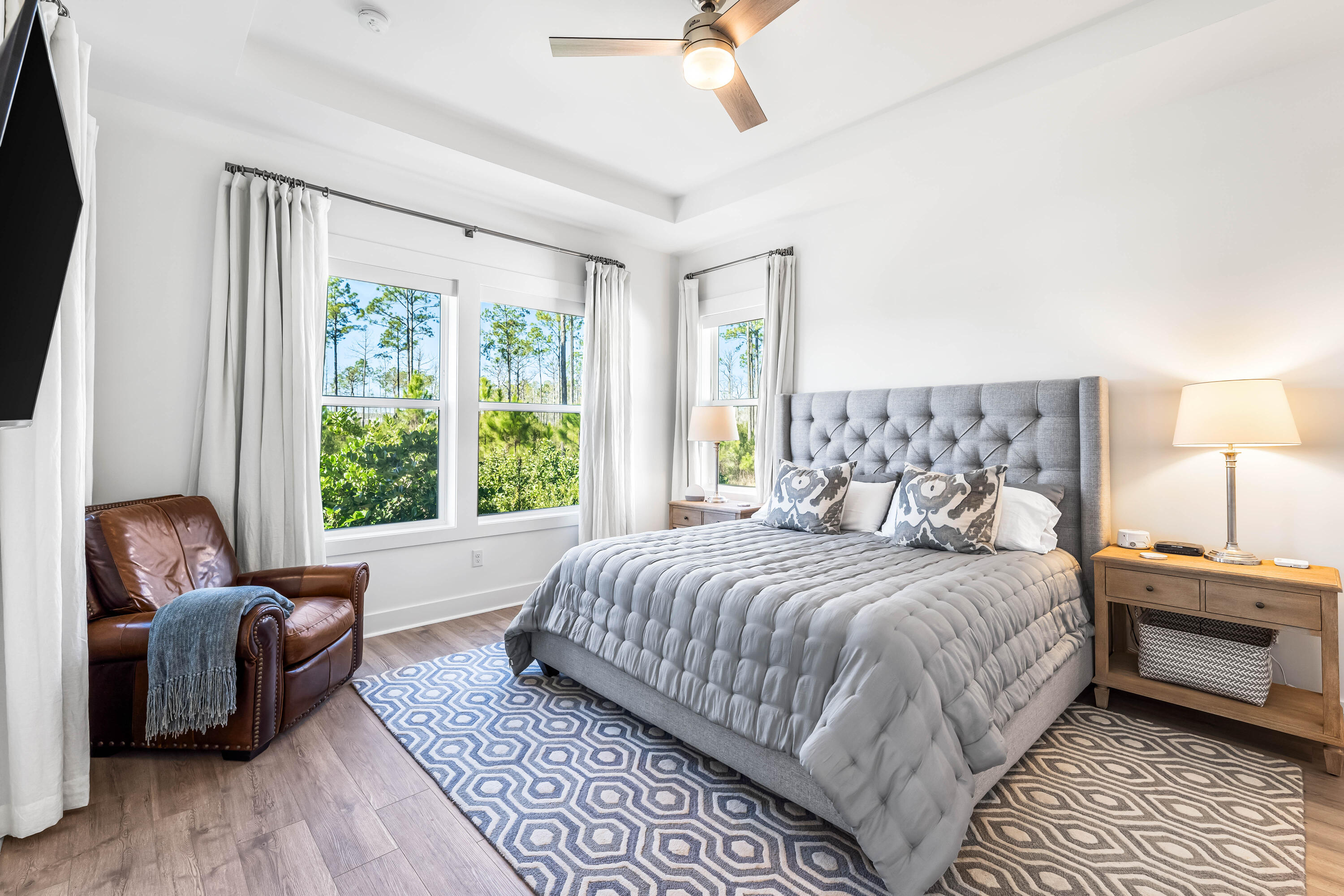 69 River Rise Way Watersound, FL 32461 - Photo 12 of 46 a bedroom with a bed and wooden floor