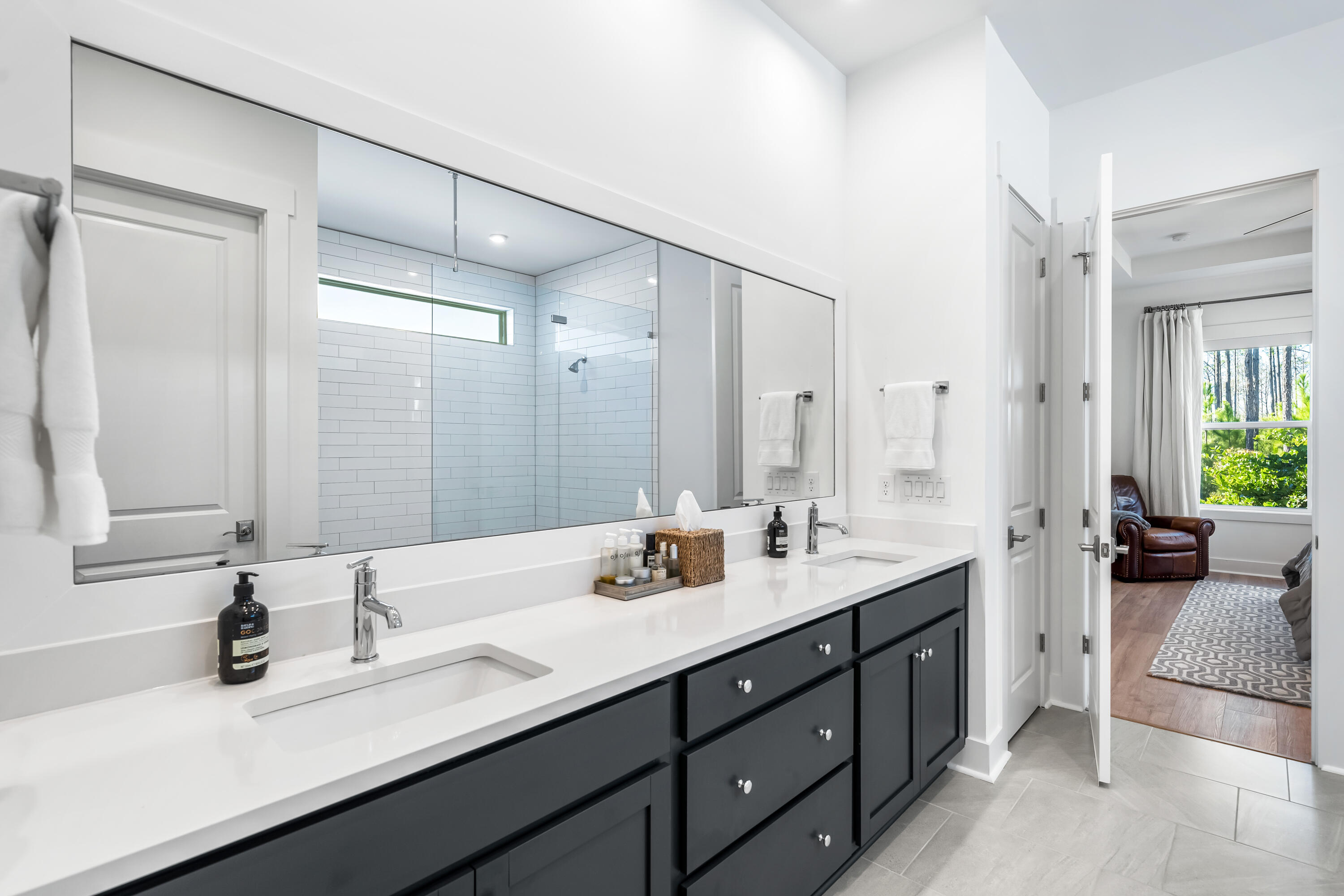 69 River Rise Way Watersound, FL 32461 - Photo 13 of 46 a bathroom with a sink double vanity and a mirror