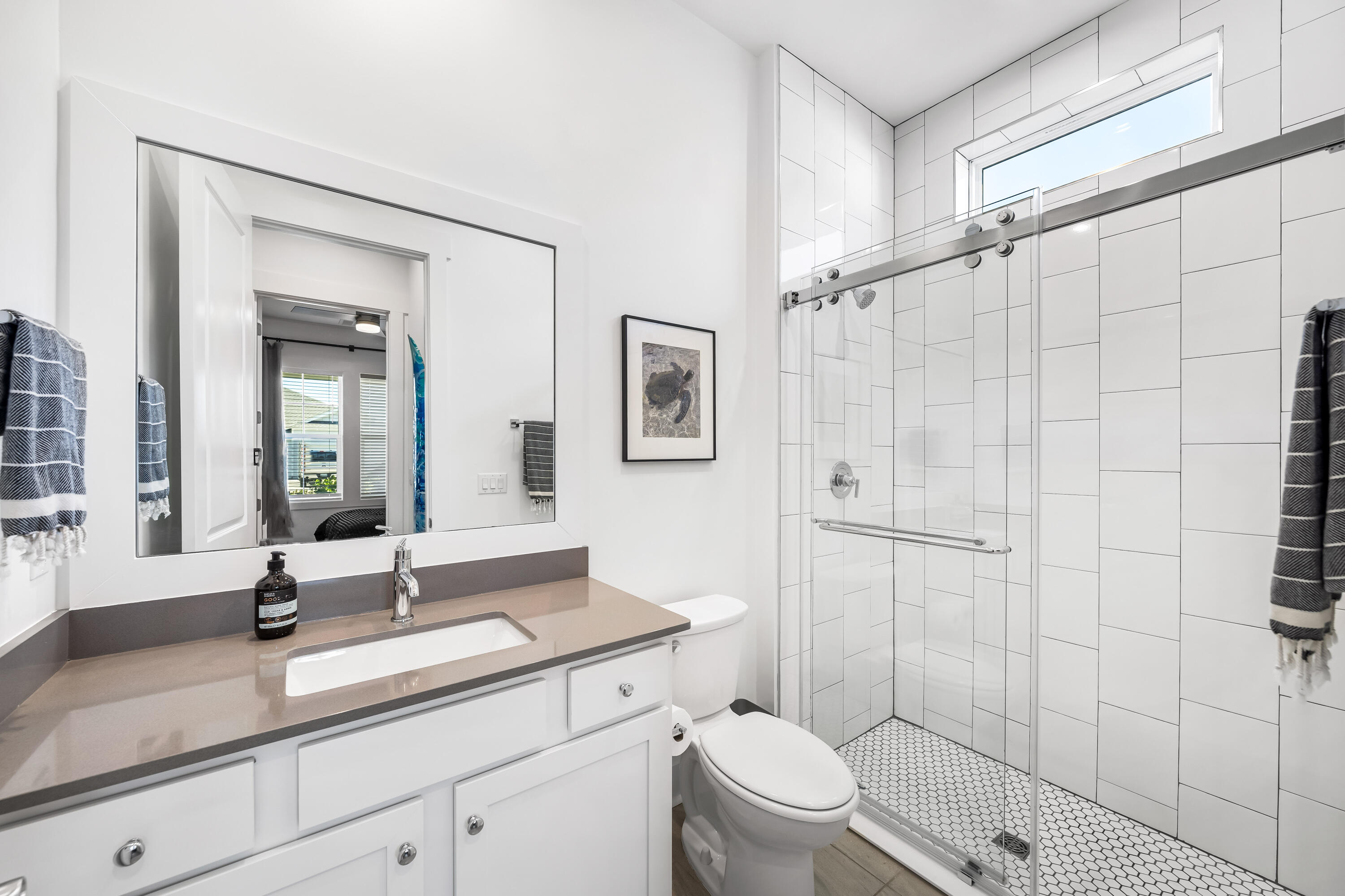 69 River Rise Way Watersound, FL 32461 - Photo 23 of 46 a bathroom with a granite countertop sink a toilet and shower