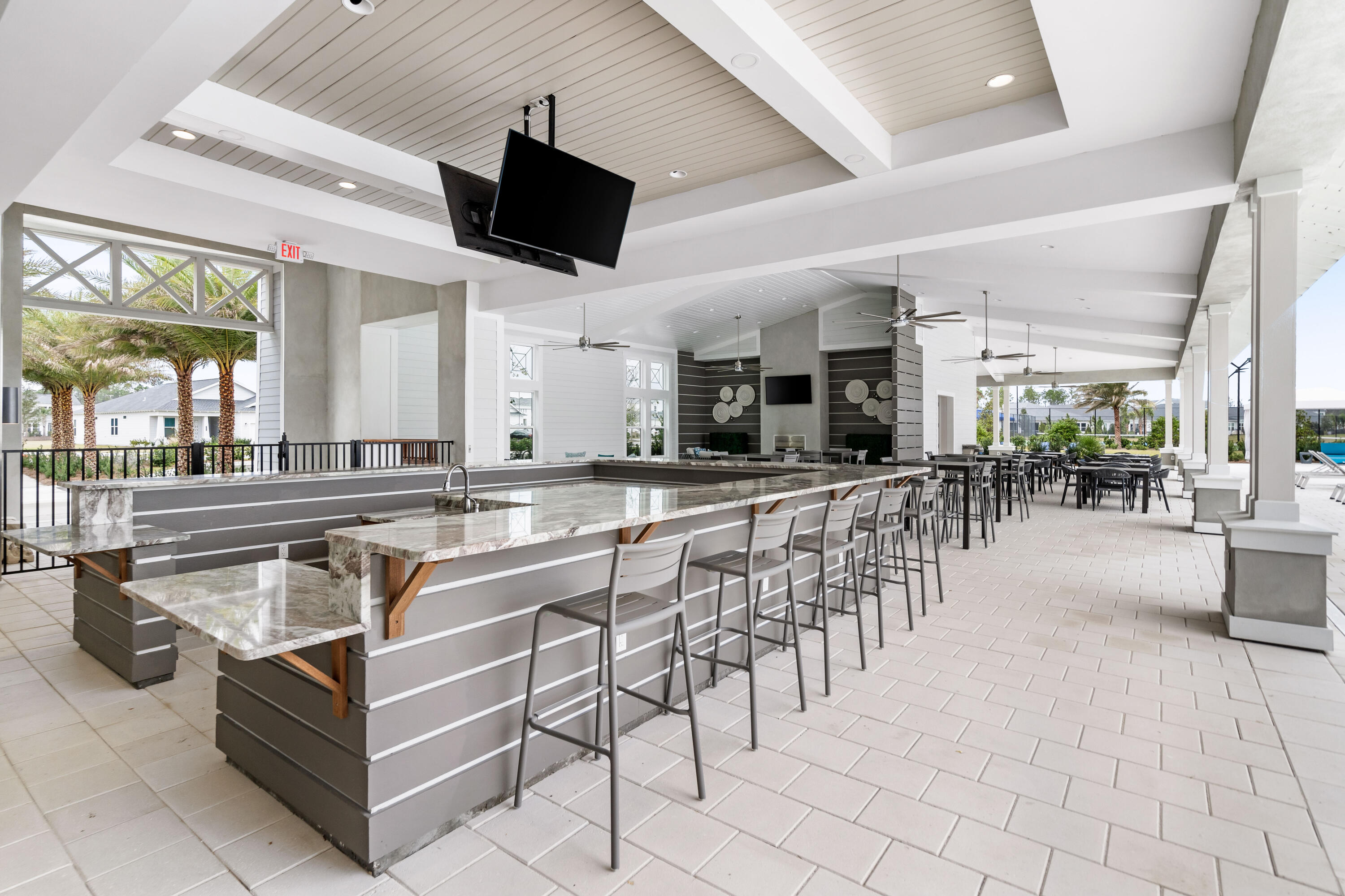69 River Rise Way Watersound, FL 32461 - Photo 32 of 46 a large white kitchen with a large counter space and stainless steel appliances
