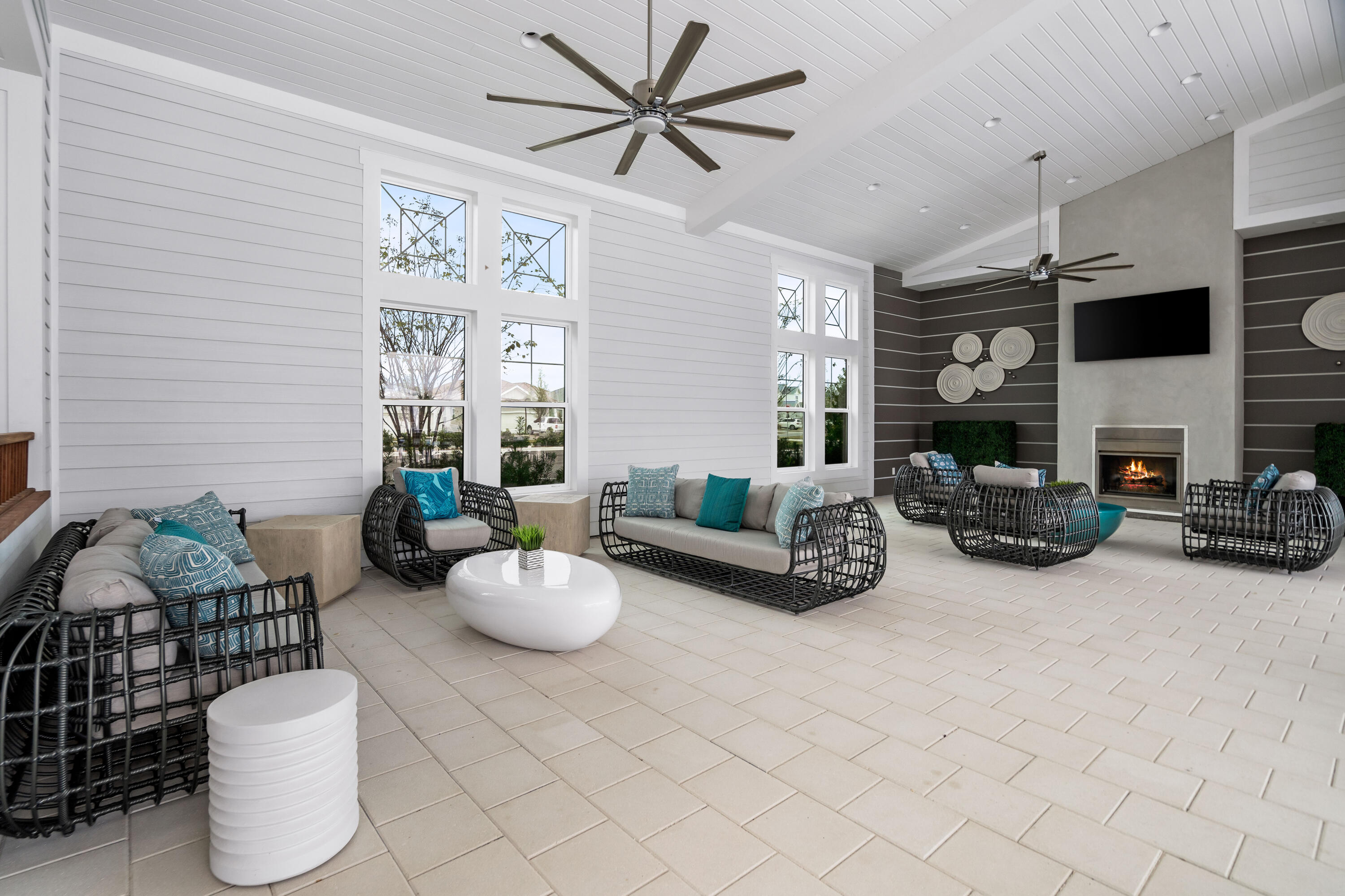 69 River Rise Way Watersound, FL 32461 - Photo 34 of 46 a living room with furniture a fireplace and a flat screen tv