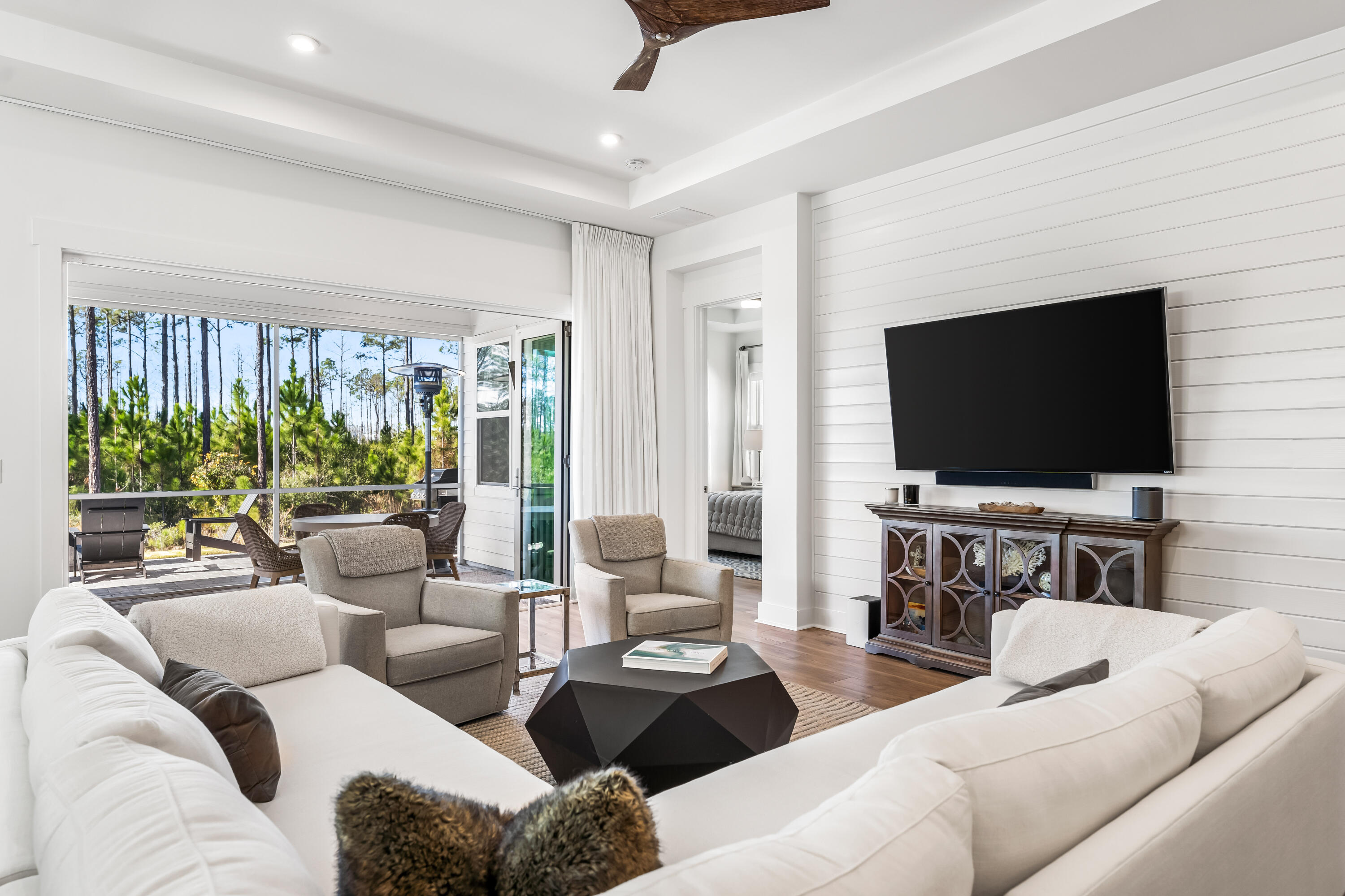69 River Rise Way Watersound, FL 32461 - Photo 5 of 46 a living room with furniture and a flat screen tv