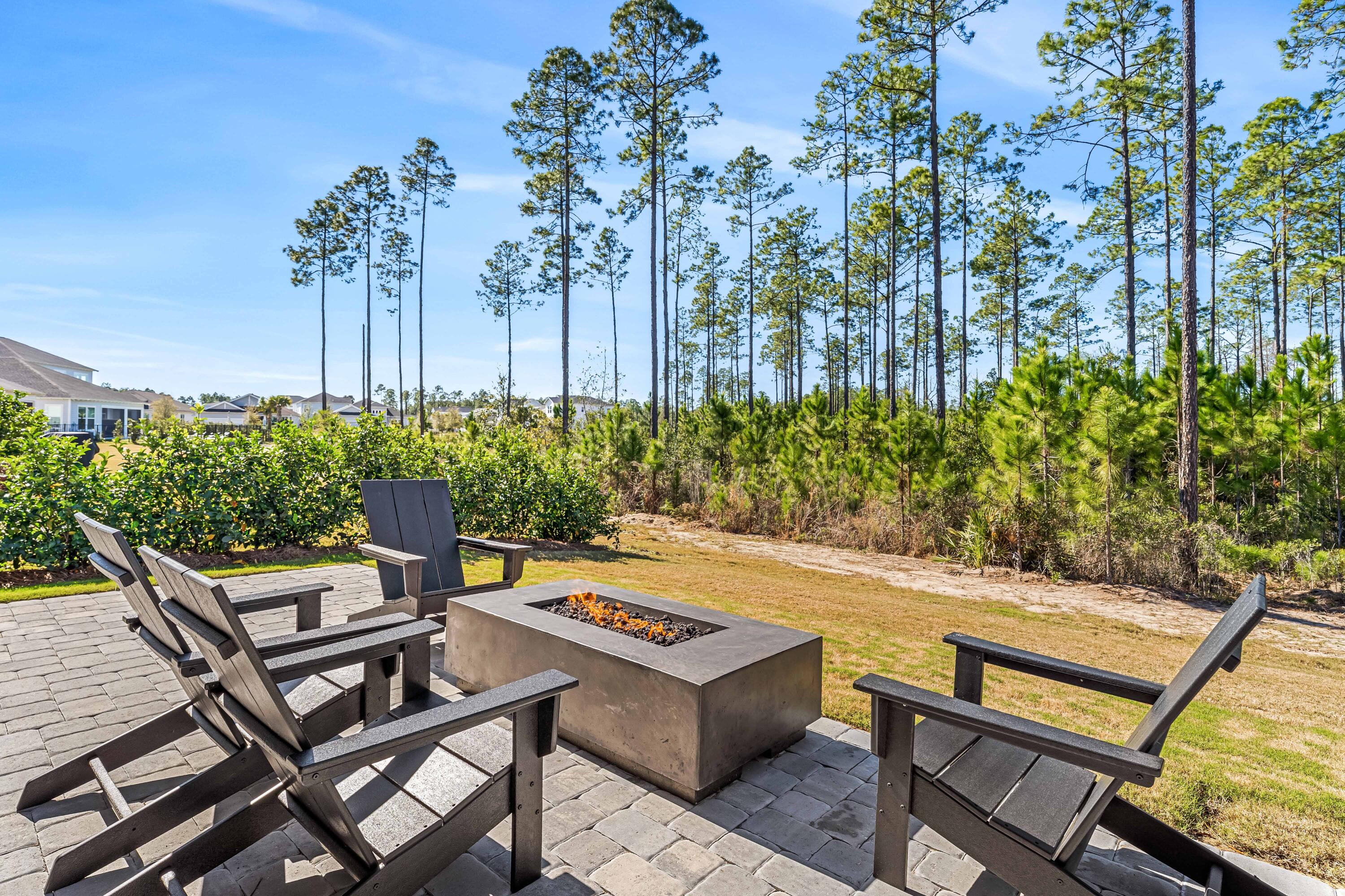 69 River Rise Way Watersound, FL 32461 - Photo 8 of 46 a view of a backyard with sitting area