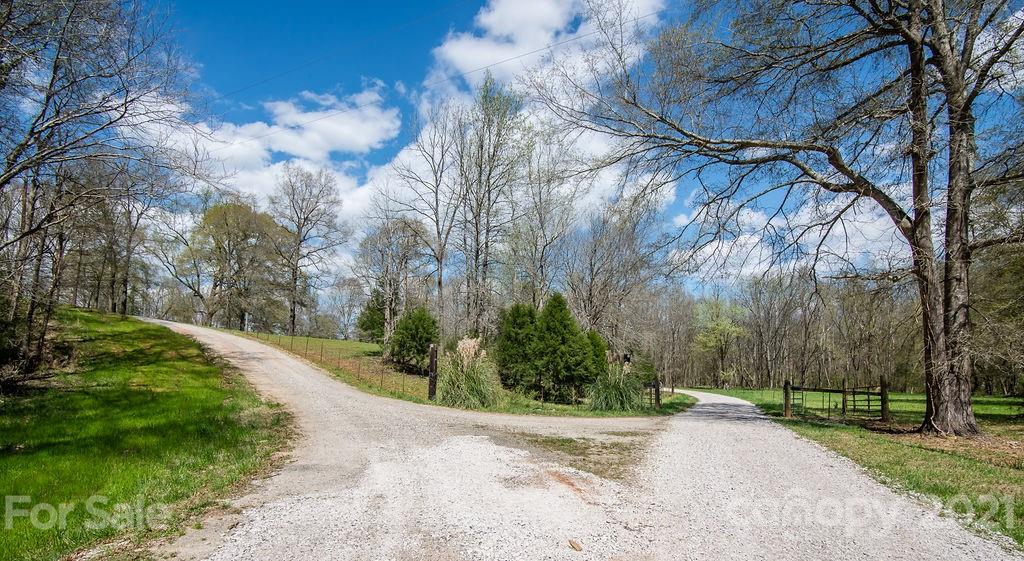 1791 Westbrook Road Edgemoor, SC 29712 - Photo 36 of 45 a view of a street with a yard and large trees
