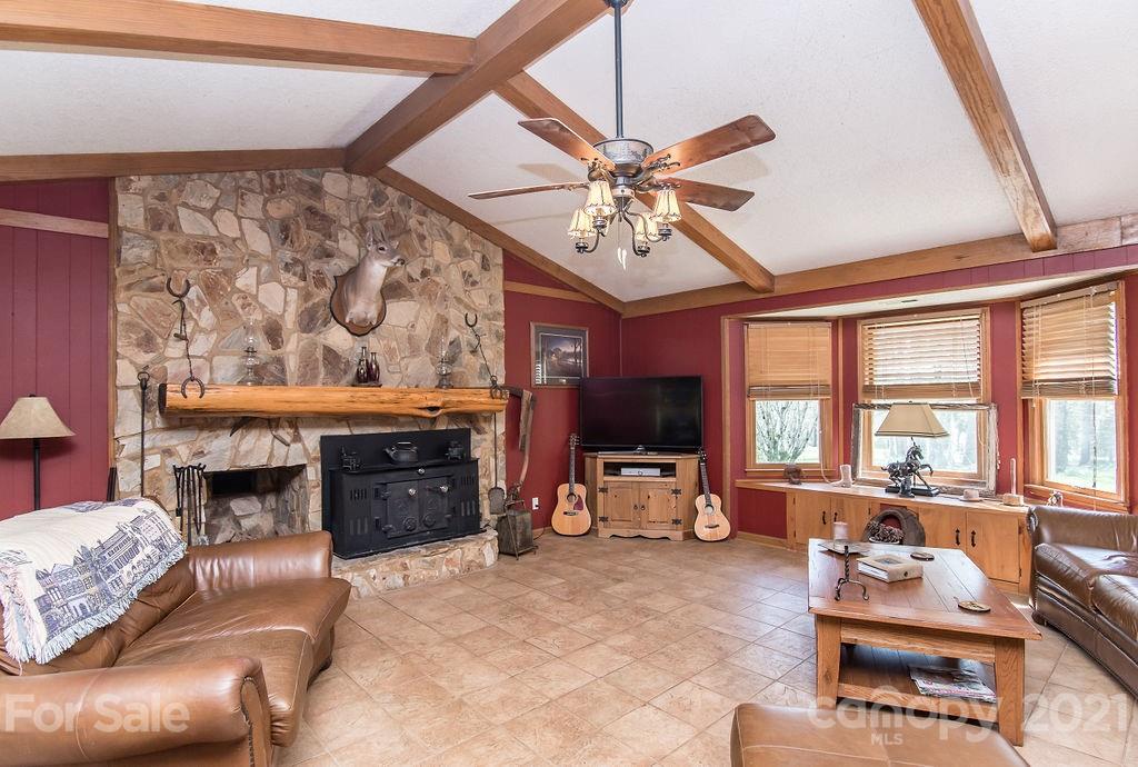 1791 Westbrook Road Edgemoor, SC 29712 - Photo 7 of 45 a living room with furniture a fireplace and a flat screen tv