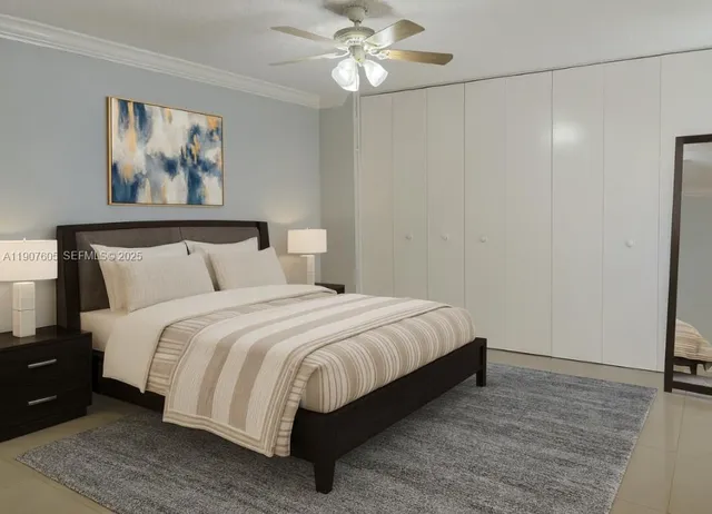 a bedroom with a bed and a painting on the wall