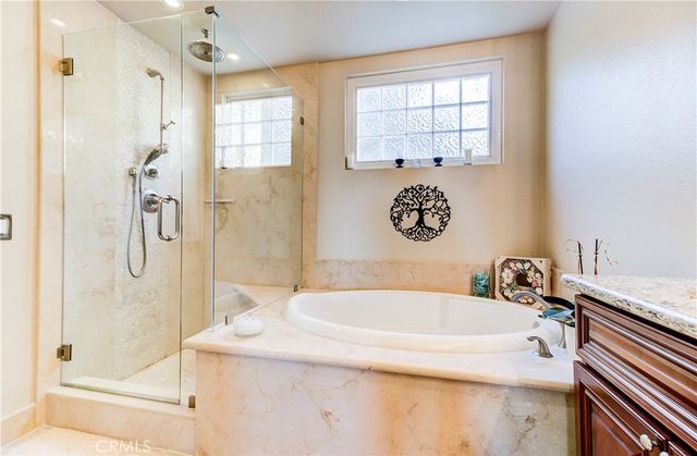 a white toilet sitting next to a shower
