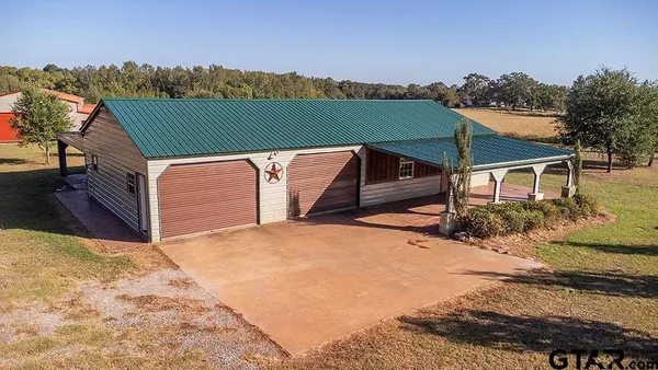 a terrace of a house with outdoor seating