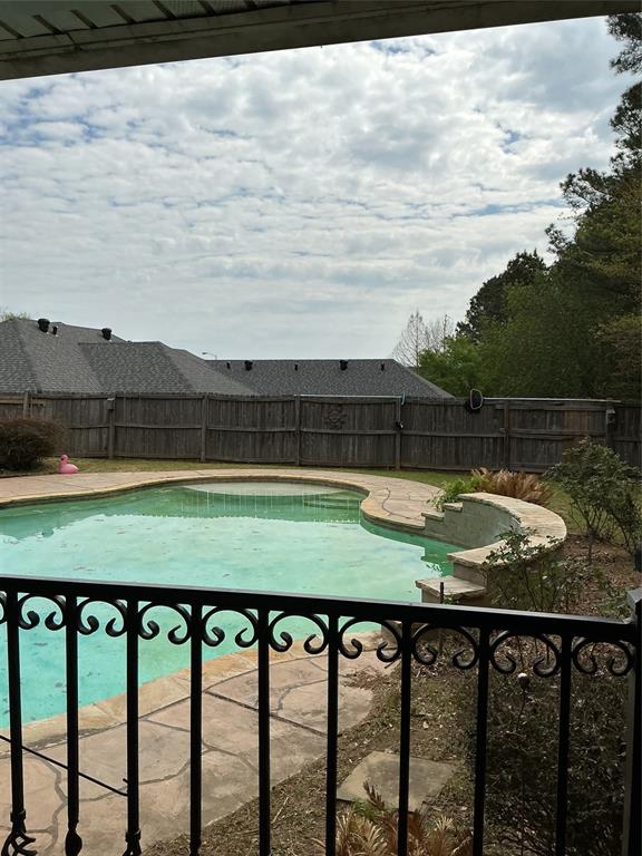 201 Woodhaven Drive Minden, LA 71055 - Photo 27 of 31 View of swimming pool with patio surround and a fenced backyard
