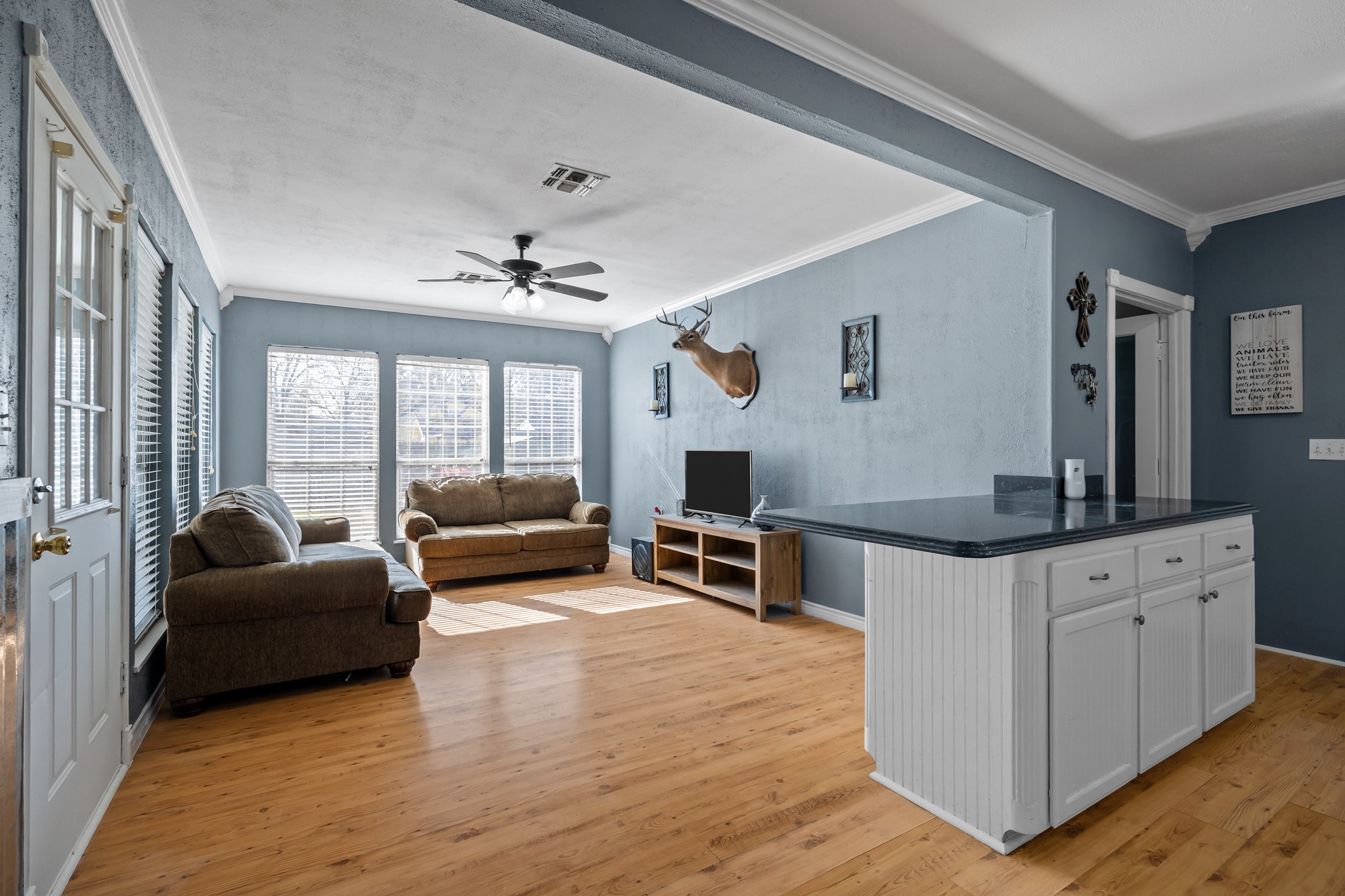 2006 Main Street Danbury, TX 77534 - Photo 11 of 30 a living room with furniture and a large window