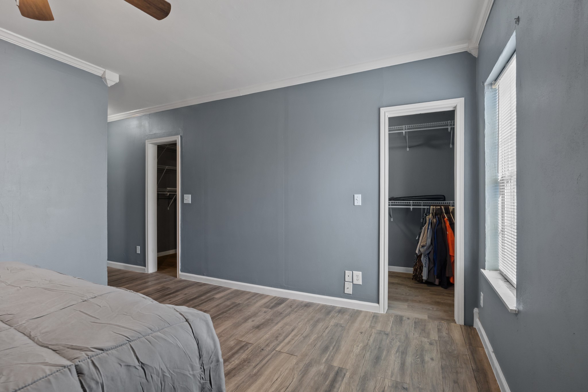 2006 Main Street Danbury, TX 77534 - Photo 17 of 30 a bedroom with a bed and a walk in closet