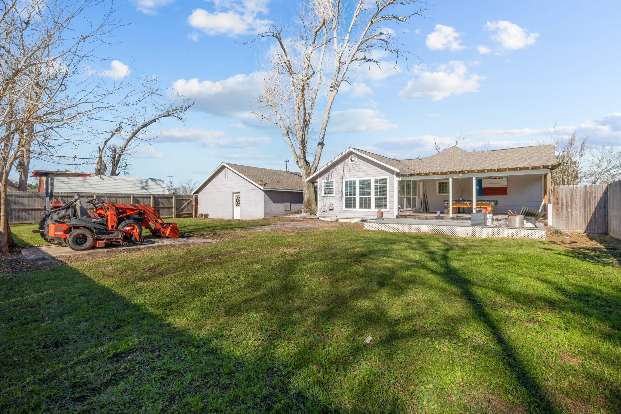 2006 Main Street Danbury, TX 77534 - Photo 29 of 30 a view of a house with a big yard and large trees