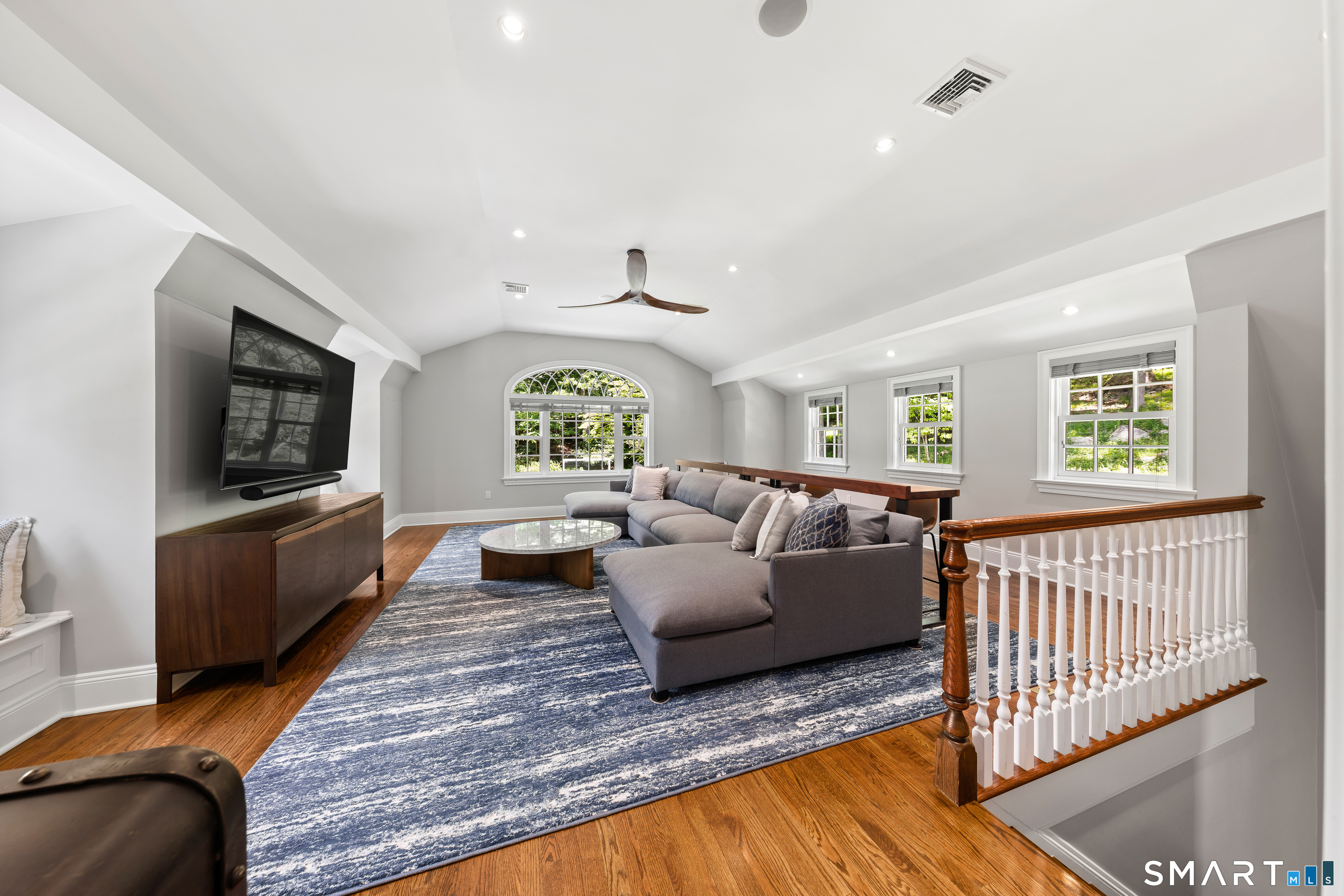 99 Hickok Road New Canaan, CT 06840 - Photo 28 of 39 a living room with furniture and a flat screen tv
