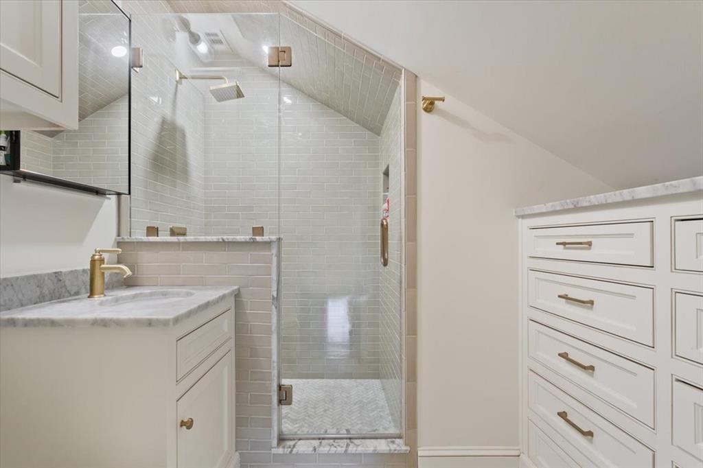 410 Rice Avenue Waco, TX 76708 - Photo 29 of 40 a bathroom with a granite countertop sink vanity mirror and shower