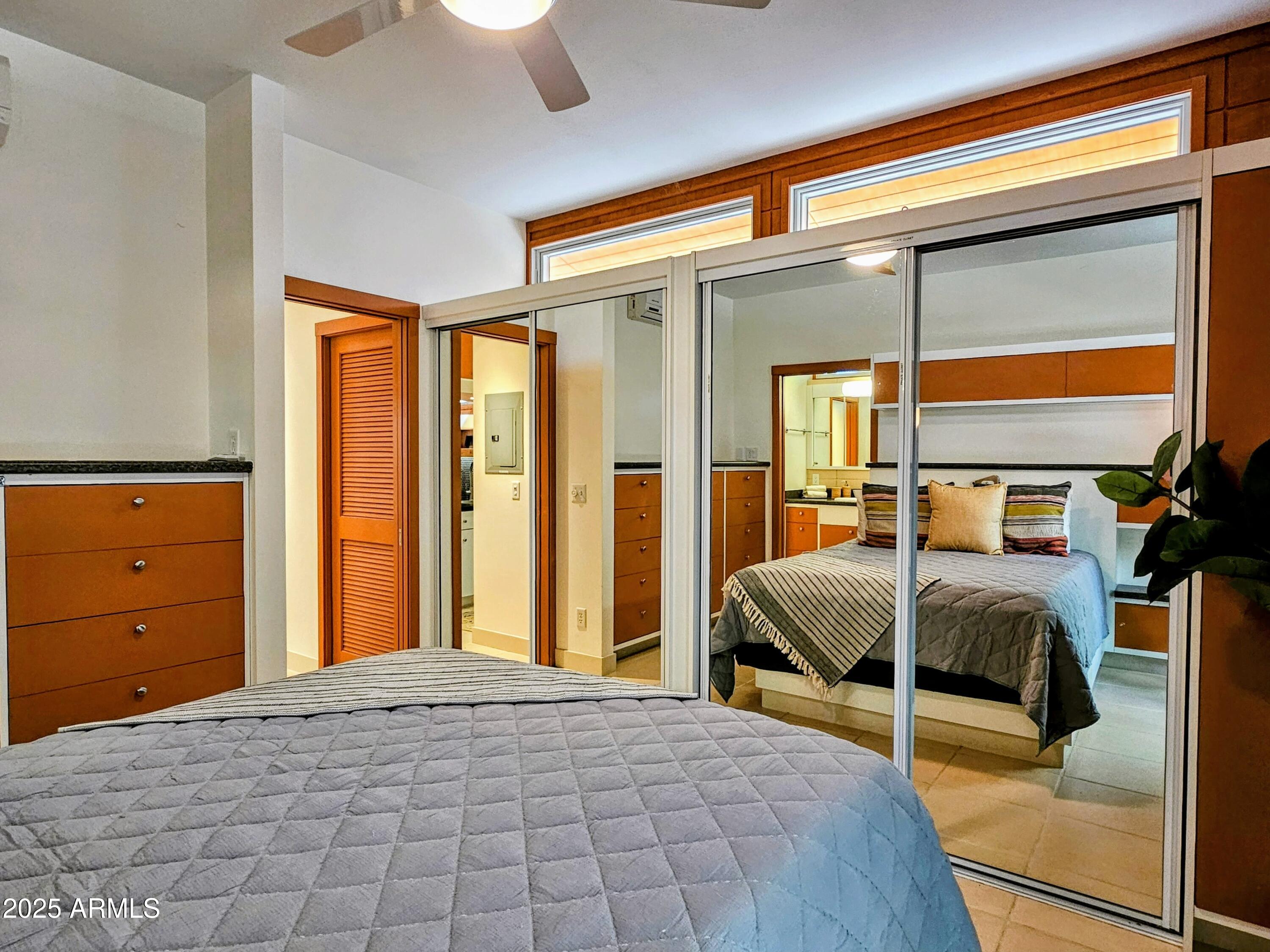 210 Opera Drive Bisbee, AZ 85603 - Photo 17 of 36 a bedroom with a bed and a dresser