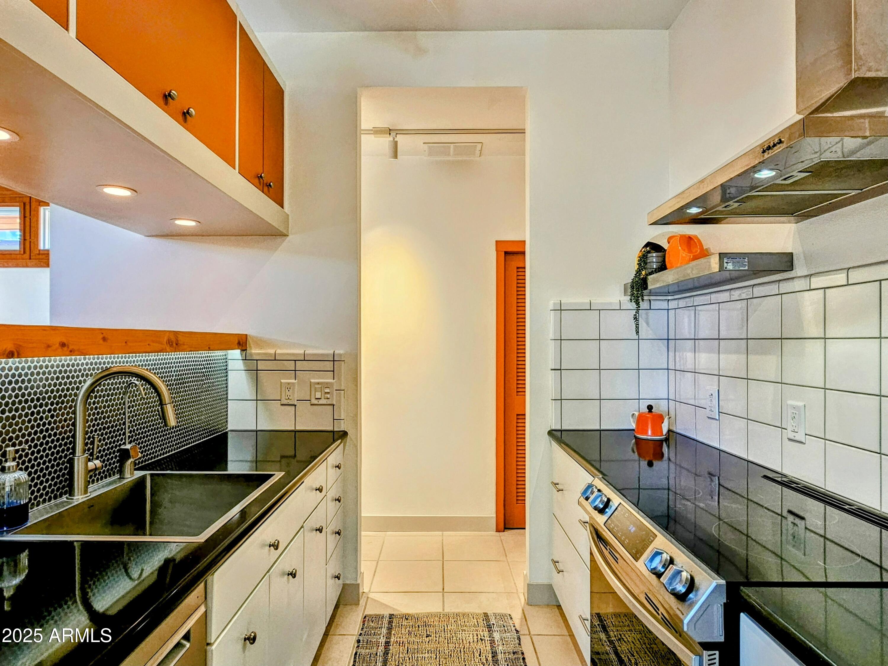 210 Opera Drive Bisbee, AZ 85603 - Photo 10 of 36 a kitchen with a sink and a stove top oven