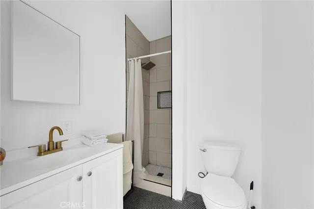 a view of a livingroom with furniture and hardwood floor