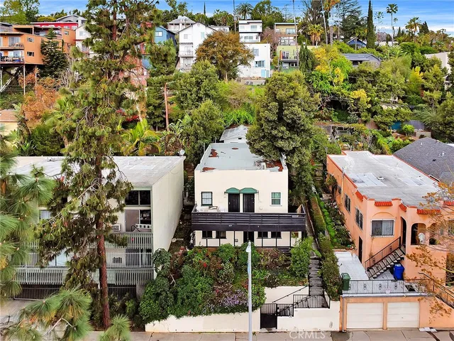 an aerial view of a house with a yard