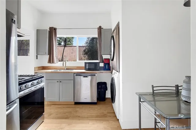 a kitchen with a sink stove and refrigerator