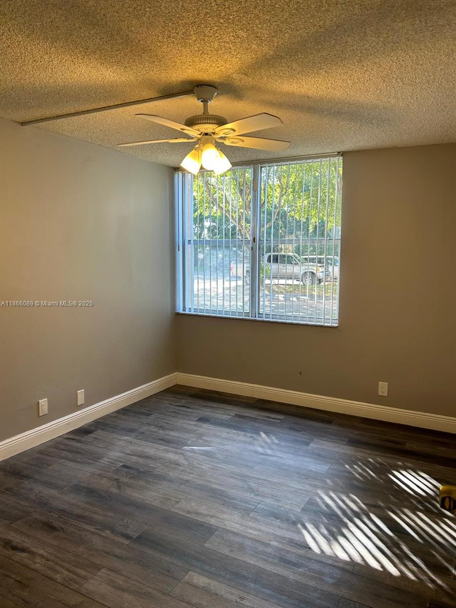 3671 Environ Boulevard, Unit 164 Lauderhill, FL 33319 - Photo 11 of 27 a view of room with window and wooden floor
