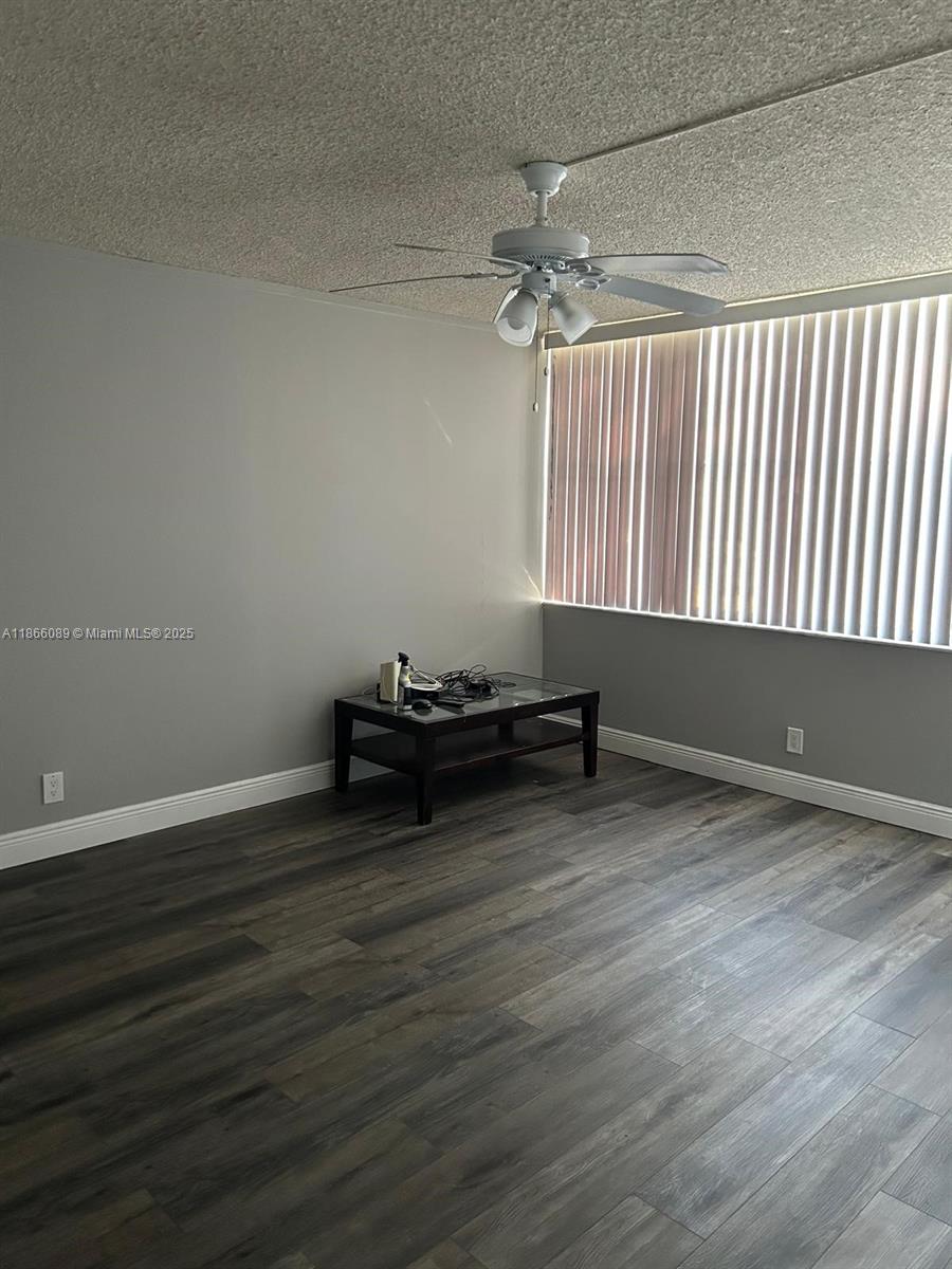 3671 Environ Boulevard, Unit 164 Lauderhill, FL 33319 - Photo 5 of 27 a view of room with wooden floor and window