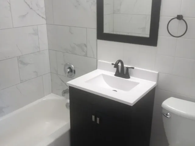 a bathroom with a sink and a bathtub