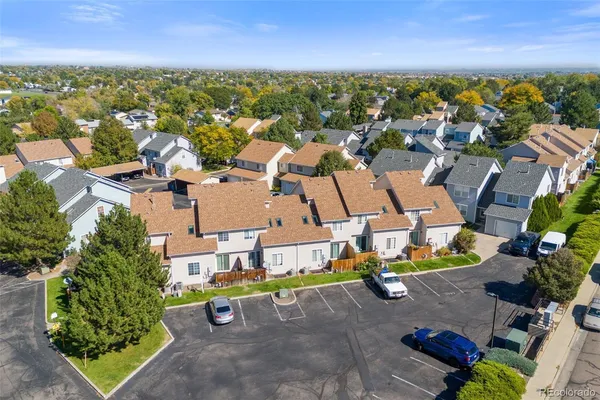 an aerial view of residential houses with outdoor space